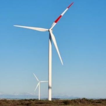 A red patterned blade on a wind turbine at the Umoya Energy Wind Farm